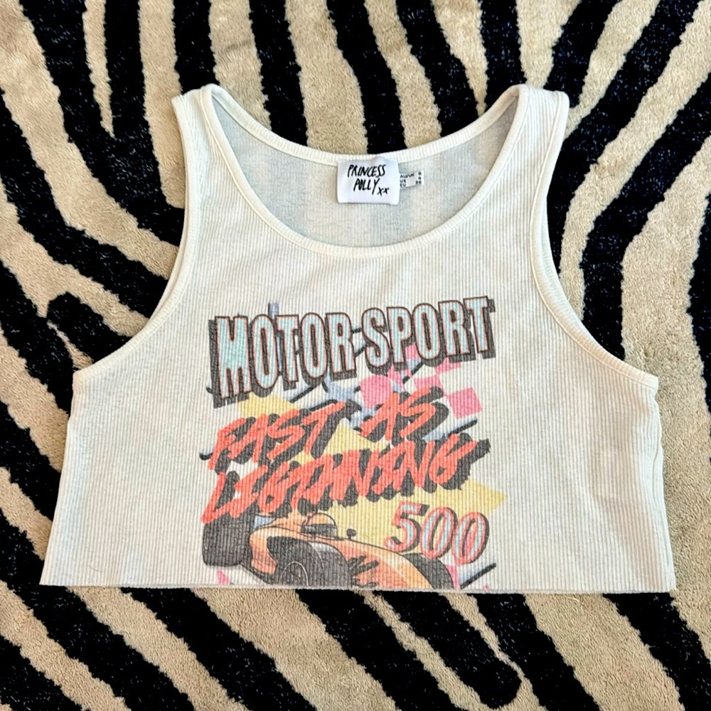 Princess Polly size 4. Crop top and slightly see thru.